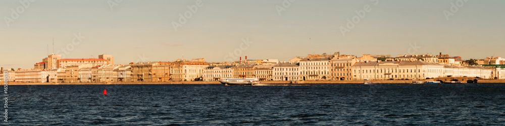 Panoramic view of the Neva River embankment in St. Petersburg.