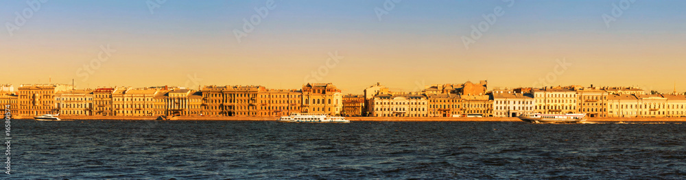 Panoramic view of the Neva River embankment in St. Petersburg.