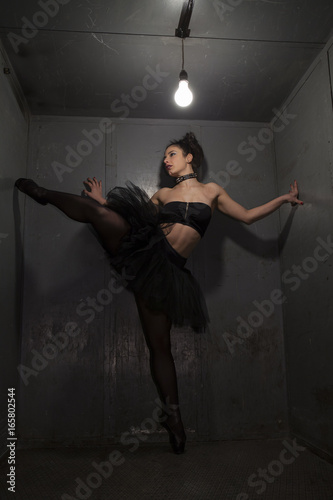 Sexy fetish ballerina in metal room.