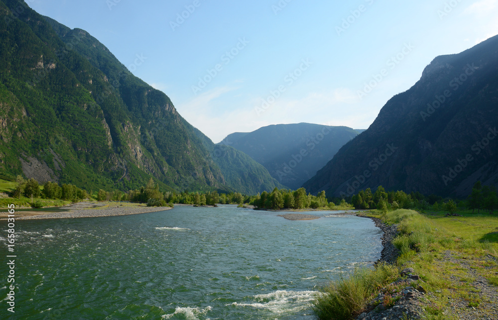 Bashkaus river flows between hills in Altai mountains. Altay Republic, Siberia, Russia