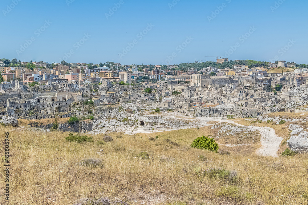 panoramic view of typical stones (Sassi di Matera) of Matera UNESCO European Capital of Culture 2019 under blue sky. Basilicata