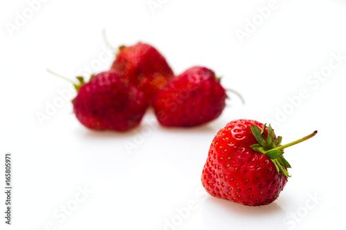 Berries of a strawberry on a white background