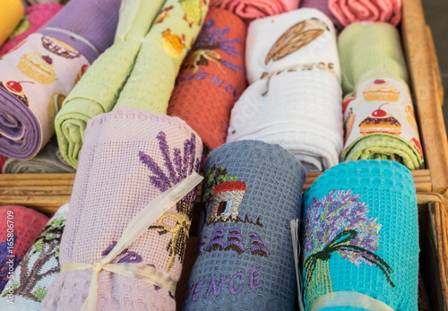 Souvenir towels with ornament sold at  local city market. Provence. France © vadiml