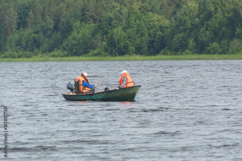 Two fisherman in a boat caught in the trap.