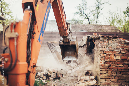 Heavy duty Hydraulic crusher excavator backoe machinery working on site demolition