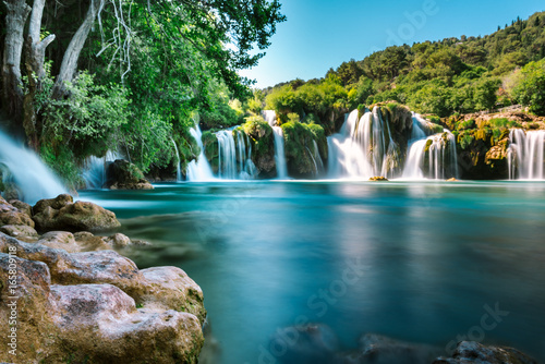 Fototapeta Naklejka Na Ścianę i Meble -  Long Exposure View of waterfall Skradinski Buk in Krka National Park one of the most famous national parks and visited by many tourists.Skradinski Buk:KRKA NATIONAL PARK,CROATIA,MAY 27,2017