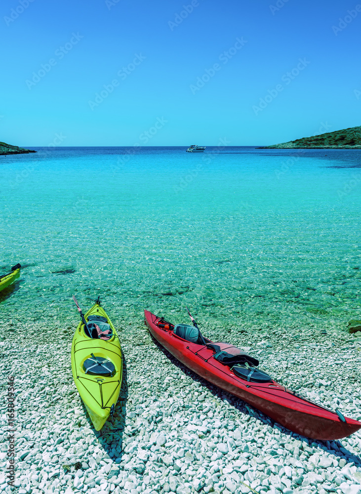 Naklejka premium Canoe Boats on a bay of Kornati islands, National park in Croatia, Adriatic sea:SIBENIK,CROATIA,May 28,2017