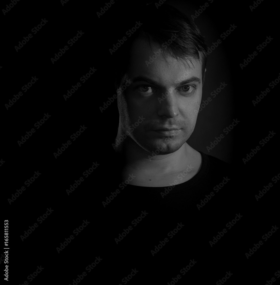 Black and white portrait of a young man. Black and white portrait of a young man.