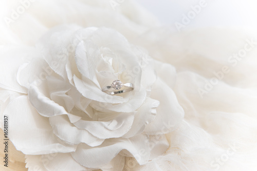 wedding ring on white rose for valentine's day © btogether.ked