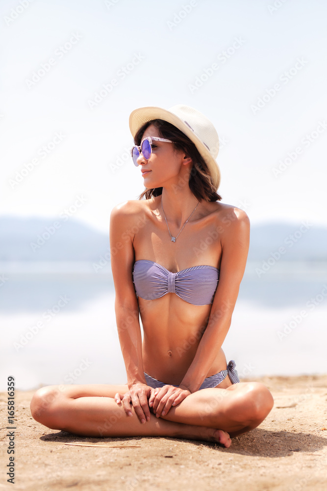 girl sunbathing on a beach girl sunbathing on a beach