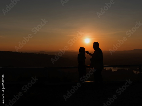 Silhouette sweethearts romantic young couple in love.