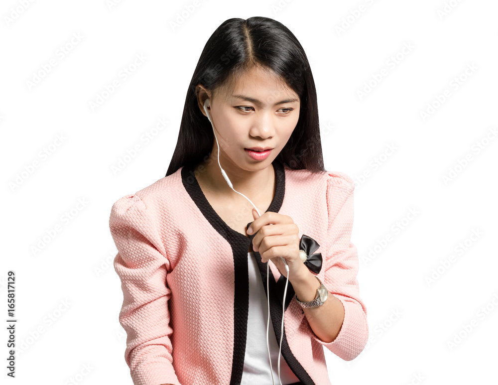 Portrait of a young business woman smiling with earbuds / headphone for listening to music or talking on smart phone. Isolated on white background with copy space and clipping path Portrait of a young business woman smiling with earbuds / headphone for listening to music or talking on smart phone. Isolated on white background with copy space and clipping path