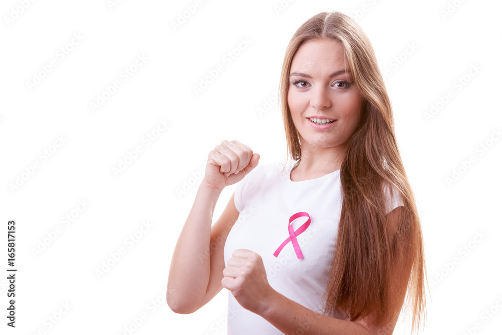 Woman wih pink ribbon on chest punching boxing Woman wih pink ribbon on chest punching boxing