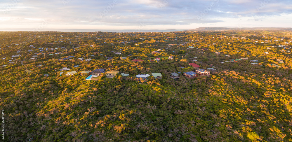 Fototapeta premium Aerial panoramic view of luxury homes in Rye suburb at sunset. Melbourne, Australia