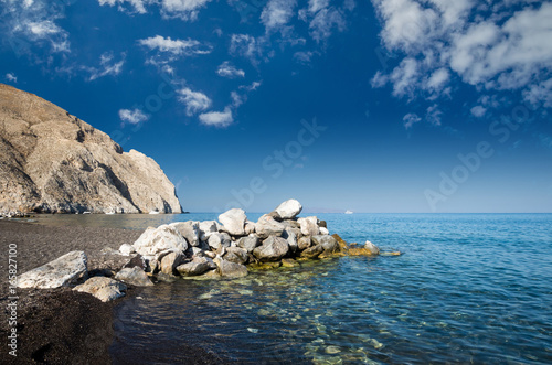 Perisa beach, Santorini, Greece. The black sand beach of Perissa on the Greek island of Thira. photo