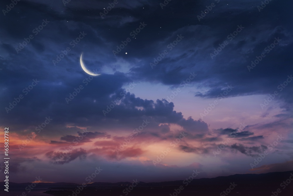 Romantic sunset and mystical moon .. Ramadan background . Prayer time . Dramatic nature background . Red sunset and moon .