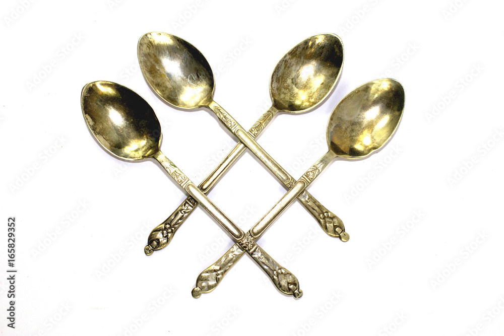 Antique Spoons on White Background