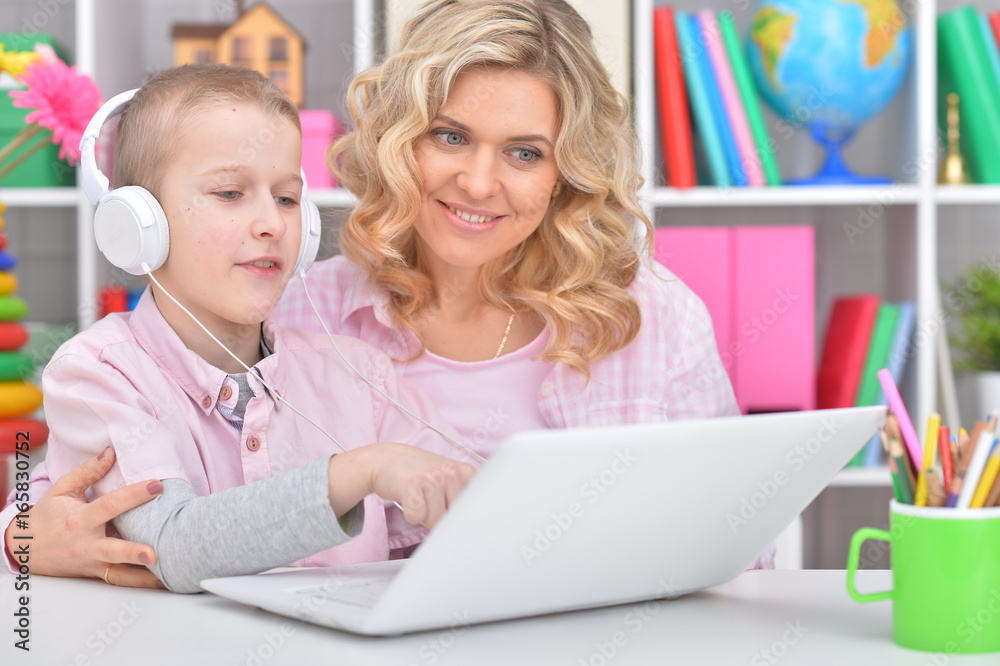 Mother and son using laptop Mother and son using laptop
