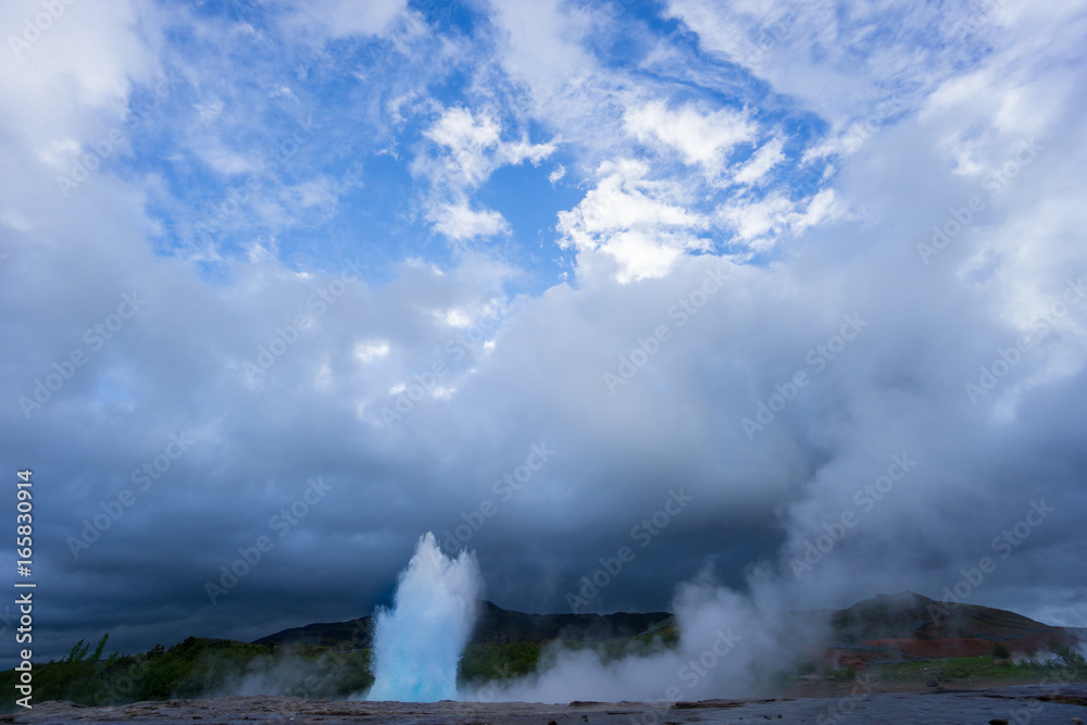 Iceland - Turquoise hot boiling water, while eruption of geyser strokkur