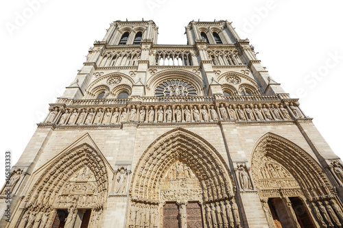 Bottom view of French Gothic architecture of Notre Dame cathedral of Paris, France. isolated on white background and copy space. Our Lady of Paris church. Central main facade.