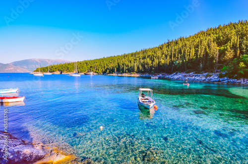 Calm and idyllic Beach of Foki Fiskardo with crystal clear and transparent water, Kefalonia, Ionian islands, Greece