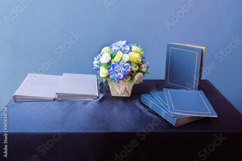 book, flowerpot and document meeting  presentation show on the blue table photo