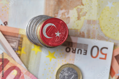 Fototapeta Naklejka Na Ścianę i Meble -  euro coin with national flag of turkey on the euro money banknotes background