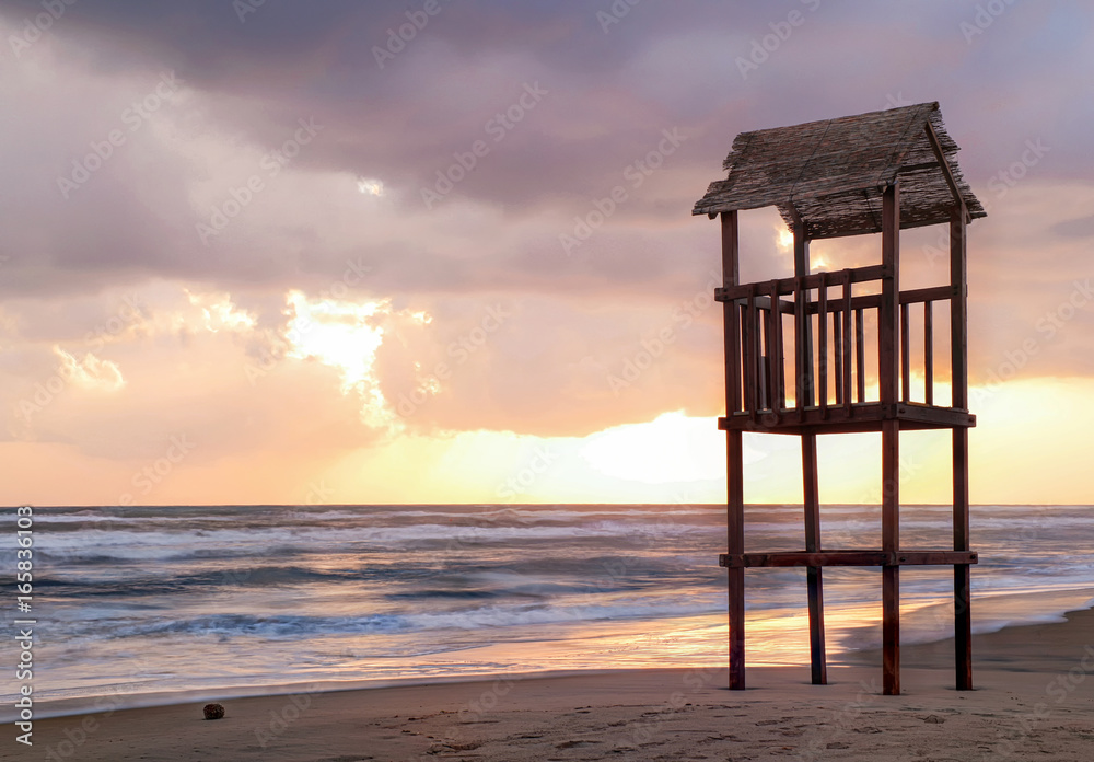 Landscape of beach with the wooden lookout tower Landscape of beach with the wooden lookout tower