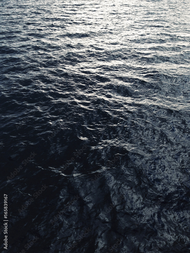 Sunlight reflecting on ocean waves at dusk Sunlight reflecting on ocean waves at dusk
