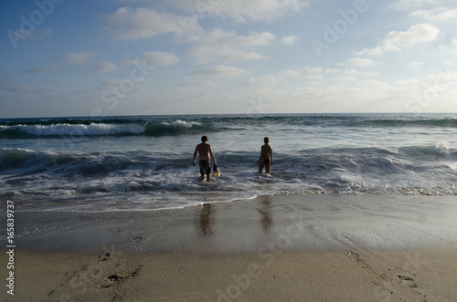 Silhouette of Two People on the Shore