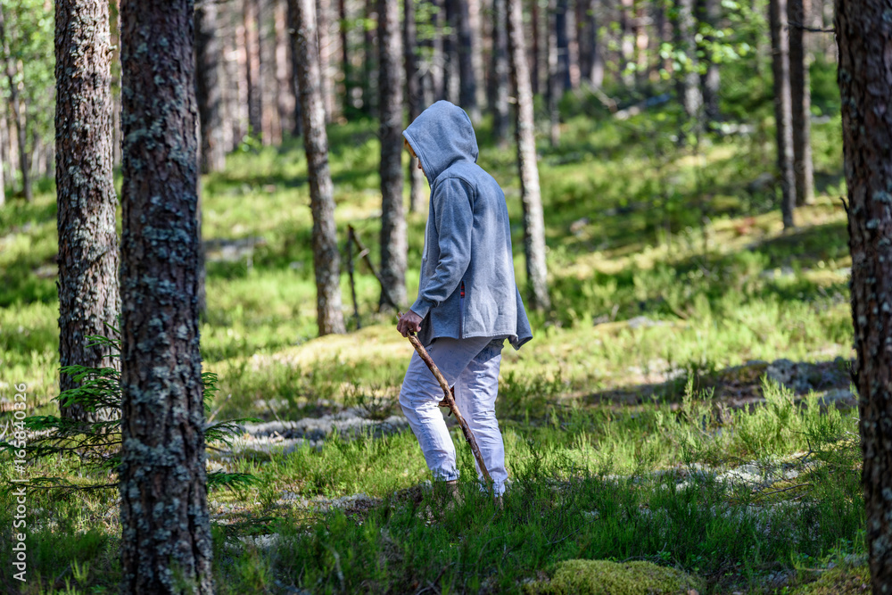 young woman enjoying nature in forest young woman enjoying nature in forest