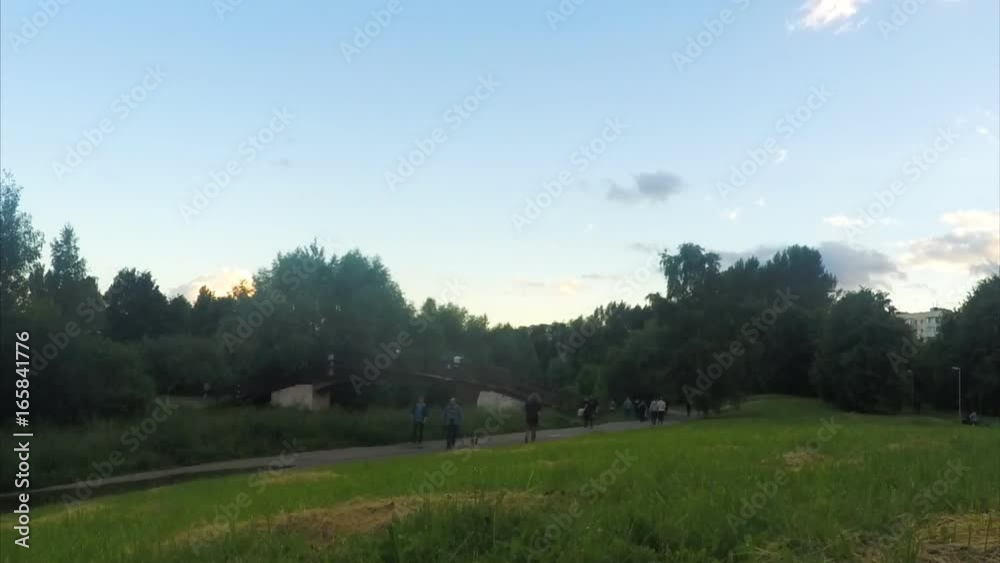 bridge over a river in evening park timelapse