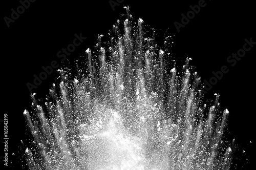 Foto Freeze motion of white dust explosion on black background