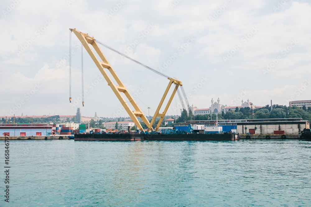 Industrial dock with loading and unloading of sea transport on the Bosporus in Istanbul, Turkey. Transportation, storage, business.