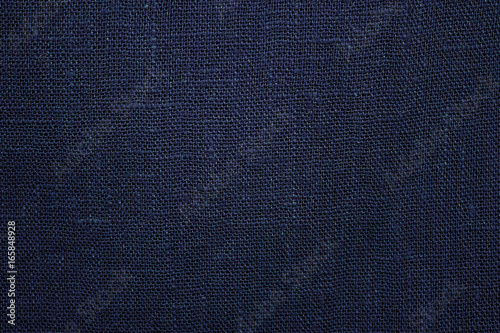 Blue linen cloth close-up background. 