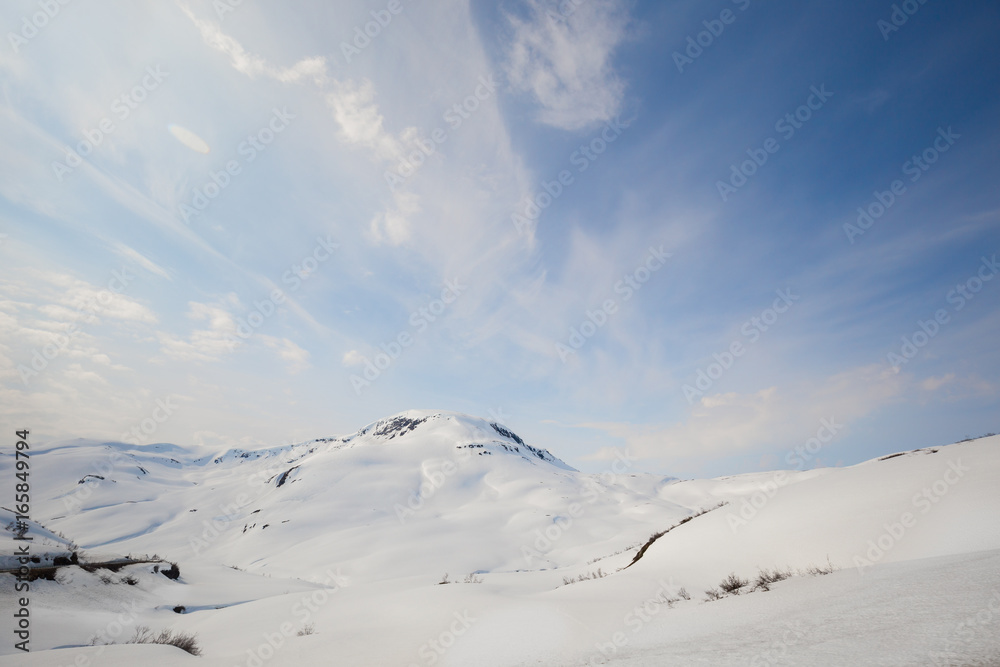 View of snowy peaks from Vikafjellet, R13 in Norway in May
