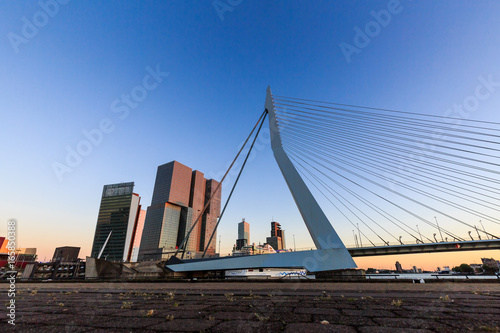 Exterior view of the Erasmus Bridge at sunset and the Maas
