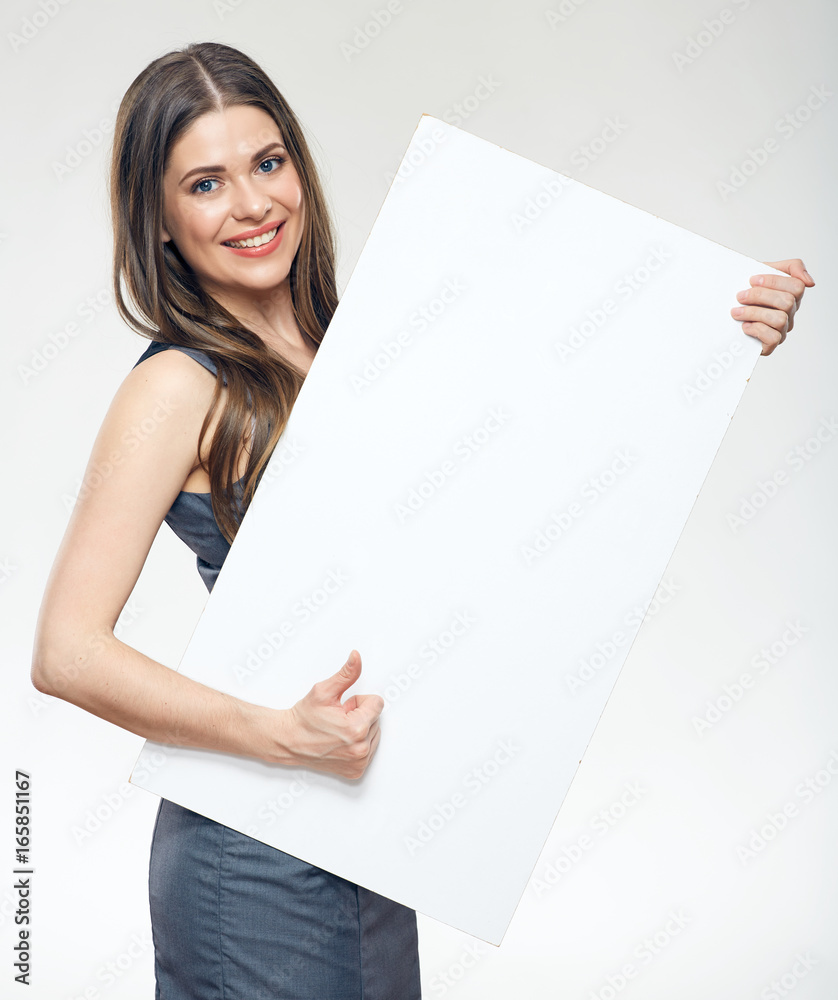 Smiling woman holding blank sign board Smiling woman holding blank sign board