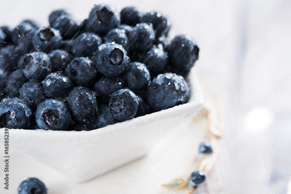 Fresh blueberries in white bowl Fresh blueberries in white bowl