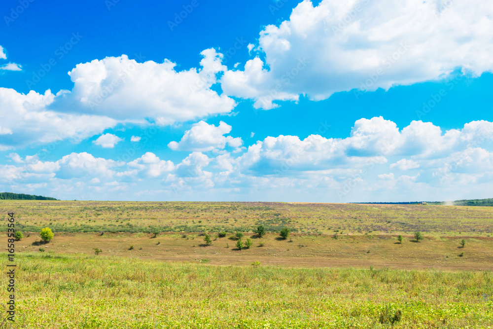 countryside with fields on the background of blue sky countryside with fields on the background of blue sky