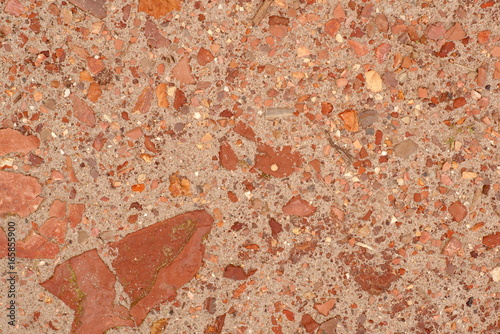 Red stones in the sand background