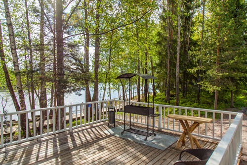 Wooden paths along the lake in the spring forest of Karelia 