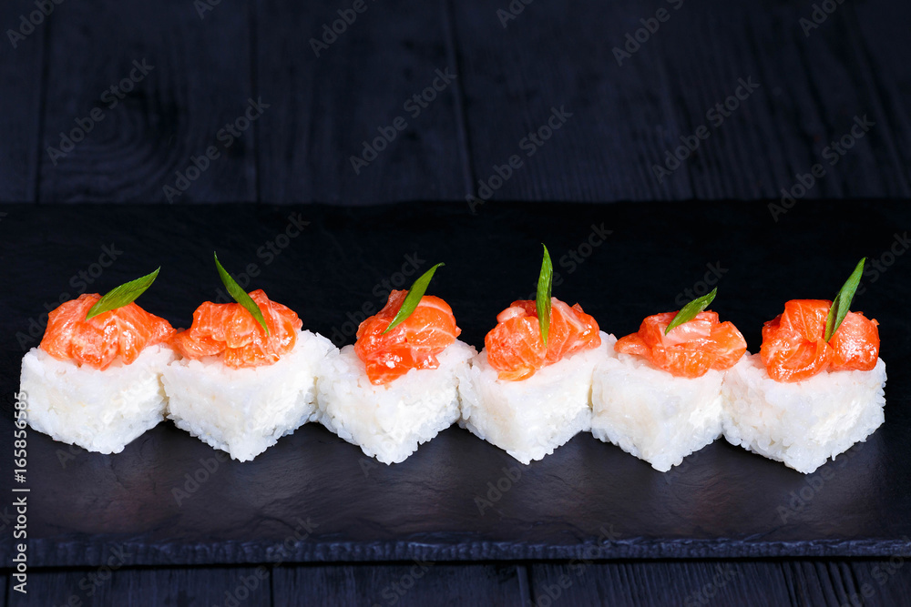 Φωτογραφία Delicious pressed sushi Oshi zushi with cream cheese and salmon, Japanese food a