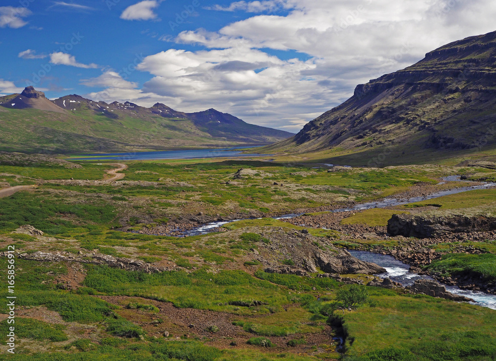 wonderful river valley with eroded mountains in west Iceland