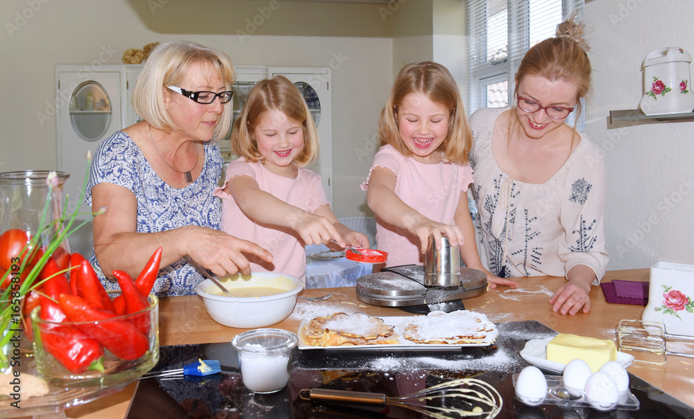 Mother and grandmother plan a family baking day for the two twins. The children get to know how to make waffles.