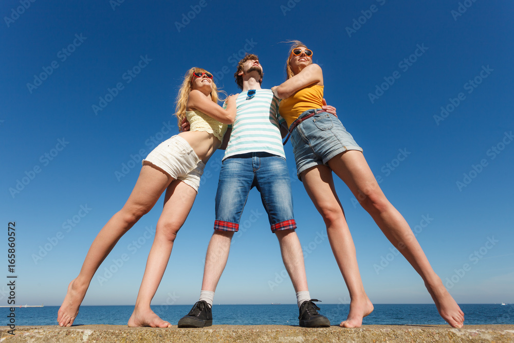 Group friends boy two girls having fun outdoor