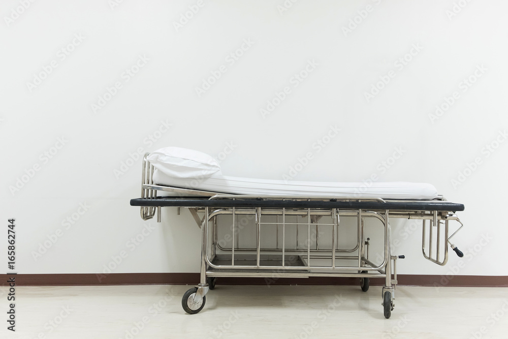 Empty stretcher trolley or hospital trolley for patient with white room. Empty stretcher trolley or hospital trolley for patient with white room.