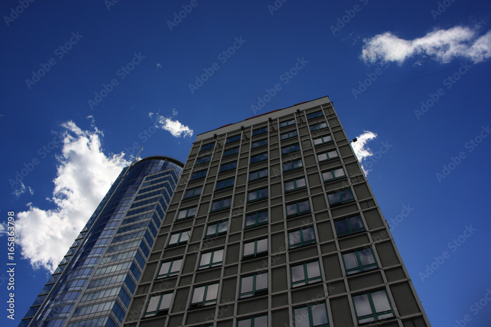 Multi-storey building/Modern multi-storey building against the sky and clouds 