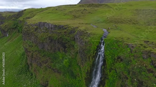 The stream falls from a rock in Iceland. Andreev. photo