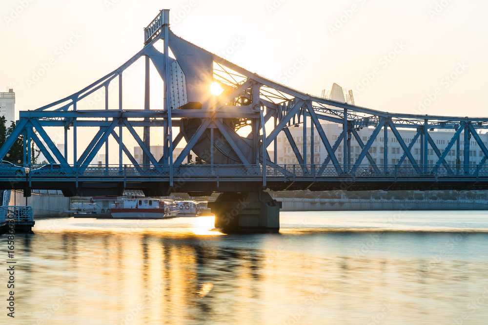 Fototapeta premium side view of steel bridge against sunset,tianjin,china.